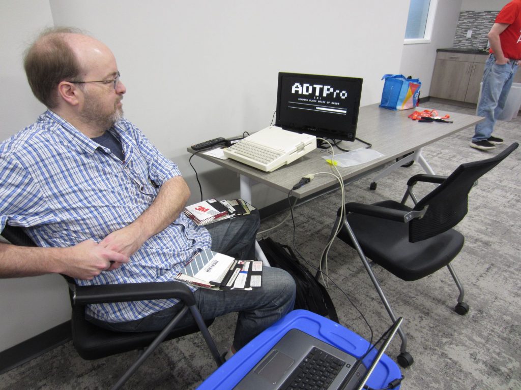 Ryan archives his Apple II floppy disks to images using ADTPro and a null modem cable.