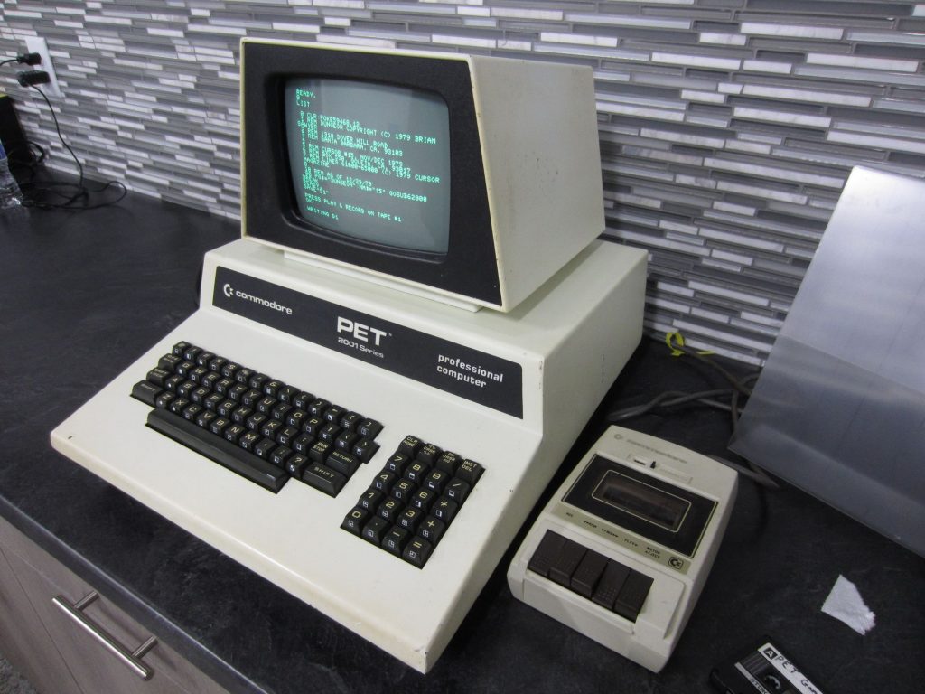 The Commodore PET is loading BASIC programs saved to tape by a Commodore 64 then a pointer in memory is changed to save the program back to tape. Upon reload, the program is now in the correct memory location for the PET to execute.