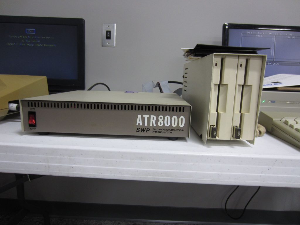 The ATR8000 connects to the Atari via SIO cable. It expands I/O options such as adding standard disk drives, as seen here. It contains a Z80 processor and 64 kB of RAM which can run CP/M! 