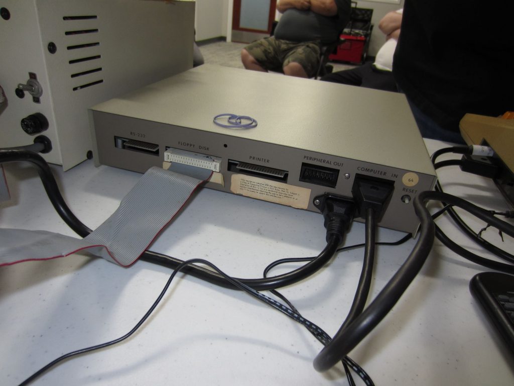The rear of the ATR8000 shows that along with being an SIO passthrough, it adds RS-232 serial, standard floppy drive I/O, and a Centronics printer interface. The 64 kB of RAM can be used as a print buffer.